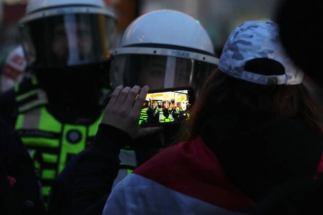 April 29, 2022, Ottawa, ON, CANADA: A protester films police during a demonstration, part of a convoy-style protest participants are calling Rolling Thunder , in Ottawa, Friday, April 29, 2022. Ottawa CANADA  - ZUMAc35_ 20220429_zaf_c35_164 Copyright: xSeanxKilpatrickx