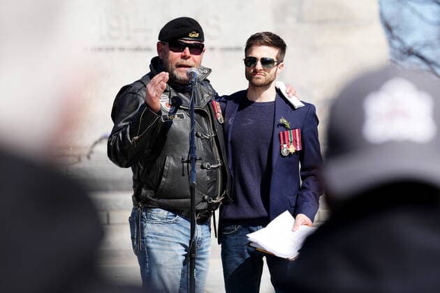 April 30, 2022, Ottawa, ON, CANADA: Neil Sheard, left, an organizer embraces Chris Deering, a guest speaker, as he speaks to protesters during a demonstration, part of a convoy-style protest participants are calling Rolling Thunder , in Ottawa, Saturday, April 30, 2022. Ottawa CANADA - ZUMAc35_ 20220430_zaf_c35_049 Copyright: xSeanxKilpatrickx