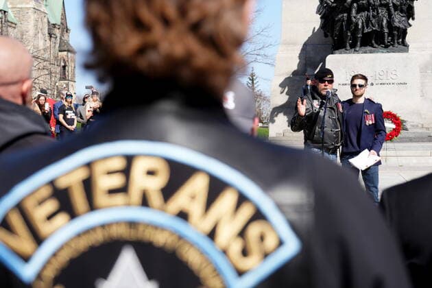 April 30, 2022, Ottawa, ON, CANADA: Neil Sheard, left, an organizer embraces Chris Deering, a guest speaker, as he speaks to protesters during a demonstration, part of a convoy-style protest participants are calling Rolling Thunder , in Ottawa, Saturday, April 30, 2022. Ottawa CANADA - ZUMAc35_ 20220430_zaf_c35_050 Copyright: xSeanxKilpatrickx