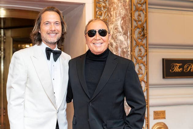 NY: Met Gala 2022 departures from The Pierre hotel Designer Michael Kors (R) and Lance Lepere seen at The Pierre Hotel for the 2022 Met Gala on a theme In America: An Anthology of Fashion with dress code calls for gilded glamour New York New York United States Copyright: LevxRadin