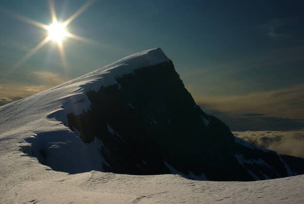 Creative Highlights World The summit of the snow-covered Glittertind (second highest peak in Norway) and the setting sun , 2284629.jpg, summit, peak, top, mount, mountain, glittertind, jotunheimen, national, park, norway, high, snow, glacier, ice, cap, cover, covered, sun, shine, shining, set, setting, ray, landscape, nature, blue, sky, white, cloud, shadow, hiking, trail, foot, step,