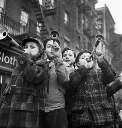 Four Boys blowing horns on New Year s Day, Bleecker Street, New York City, New York, USA, Marjory Collins, U.S. Office of War Information U.S. Farm Security Administration, January 1943  Copyright: xCircaxImagesx ghi-circa11028