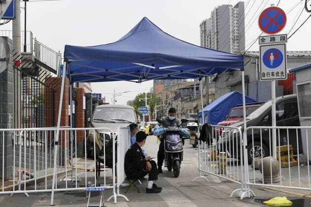 COVID-19 fears in Beijing A fence is set up on a road in Beijing on May 9, 2022, to block entry amid growing fears of COVID-19 cases.  A14AA0001288007P