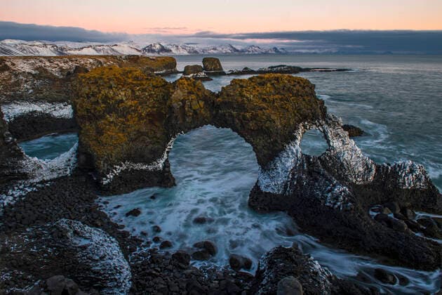 Creative Highlights World the famous rock arch in Arnastapi on the Snaefellsnes peninsula Arnarstapi, Iceland CR_THHE211213-885497-01