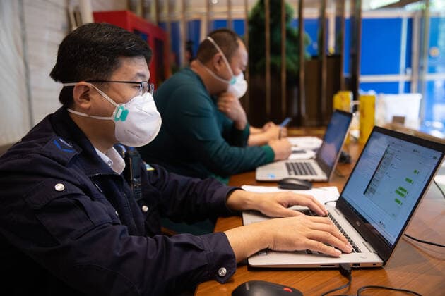 (220510) -- SHANGHAI, May 10, 2022 -- Li Shuai works at the headquarters of a medical emergency team on Caoyang Road in east China s Shanghai, May 9, 2022. A medical emergency team consisting of 108 members with 50 ambulances from north China s Tianjin has arrived at Shanghai to assist in the city s public medical emergency service amid the COVID-19 resurgence. ) CHINA-SHANGHAI-MEDICAL TEAM-COVID-19-AID (CN) JinxLiwang 