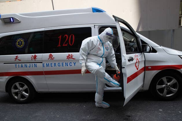 (220510) -- SHANGHAI, May 10, 2022 -- Meng Xiangjun conducts disinfection after transferring a COVID-19 patient in east China s Shanghai, May 9, 2022. A medical emergency team consisting of 108 members with 50 ambulances from north China s Tianjin has arrived at Shanghai to assist in the city s public medical emergency service amid the COVID-19 resurgence. ) CHINA-SHANGHAI-MEDICAL TEAM-COVID-19-AID (CN) JinxLiwang 