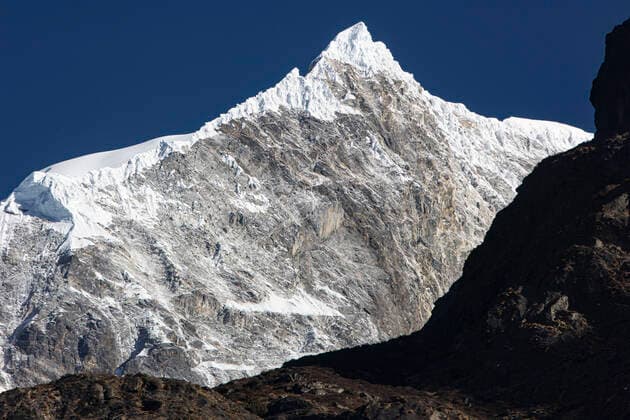 Creative Highlights World Langtang Lirung Mountain In The Himalayas Langtang Lirung peak as seen from Langtang village, part of the Langtang Himal mountain in Nepal with the highest point at the elevation of 7234m or 23734 ft. Langtang Lirung is the 99th tallest mountain in the world and the summit was reached for the first time in 1978. On April 25, 2015, a massive 7.8 magnitude earthquake resulted in an avalanche and landslide in Langtang village directly killing 243 and vanishing the village. Langtang National Park is a popular trekking and travel destination for foreign trekkers and locals, people living in the village are Tamang Tibetan with origin from Tibet. Langtang, Nepal on April 4, 2022 Langtang Nepal  Copyright: xNicolasxEconomoux originalFilename: economou-langtang220404_np7uf.jpg