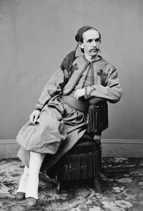 John Harrison Surratt, Jr. John Harrison Surratt, Jr. (April 13, 1844 â€“ April 21, 1916) was accused of plotting with John Wilkes Booth to kidnap U.S. president Abraham Lincoln and suspected of involvement in the Abraham Lincoln assassination. His mother Mary Surratt was convicted of conspiracy and hanged by the United States Federal Government. She owned the boarding house where Booth and fellow conspirators planned the scheme. John Harrison Surratt, Jr. avoided arrest immediately after the assassination by fleeing the country. He served briefly as a Papal Zouave before his arrest and extradition. By the time he returned to the United States the statute of limitations had expired on most of the potential charges and he was not convicted. 18 Copyright: xPhoto12 AnnxRonanxPicturexLibraryx ARP18A00_481