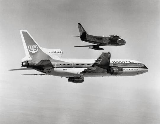 Lockheed L-1011 TriStar and F-86 Sabre fighter, 1976 Inaugural flight of the prototype Lockheed L-1011 TriStarmedium-to-long-range trijet airliner, accompanied by the North American F-86 Sabre transonic jet fighter aircraft. November 16, 1976 Copyright: xPhoto12 CollectionxBernardxCrochetx CRO18A00_380