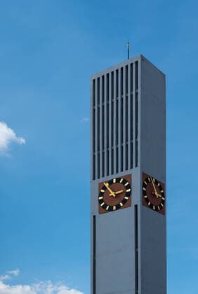 Creative Highlights World Posterholt, Limburg, The Netherlands - 04 16 2022 - Rectangular contemporary church tower against blue sky