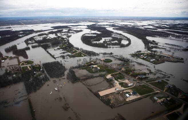 May 15, 2022, WINNIPEG, MB, CANADA: The Red River overflows its banks south of Winnipeg, Sunday, May 15, 2022. WINNIPEG CANADA  - ZUMAc35_ 20220515_zaf_c35_050 Copyright: xJohnxWoodsx