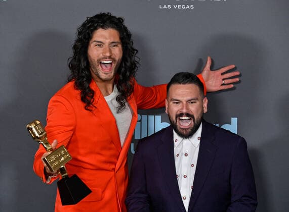 Shay Mooney and Dan Smyers of Dan + Shay appear backstage with their award during the annual Billboard Music Awards held at the MGM Grand Garden Arena in Las Vegas on May 15, 2022. The musicians were honored as Top Country Duo Group.  LAV202205150627 JIMxRUYMEN
