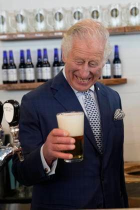 May 17, 2022, St. John s, NL, Canada: Prince Charles reacts to a bad pour of beer he made at the Quidi Vidi Brewery, located in a fishing village in the east end of St. JohnöÄÃ s, during their Canadian Royal tour, Tuesday, May 17, 2022. St. John s Canada  - ZUMAc35_ 20220517_zaf_c35_202 Copyright: xPaulxChiassonx
