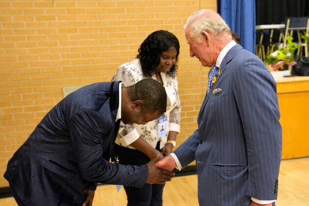 May 18, 2022, Ottawa, ON, Canada: Samuel Awoyem bows to Prince Charles as his wife Toyin Awoyem looks on during a visit to the Assumption Elementary School in Ottawa, Wednesday, May 18, 2022. Ottawa Canada  - ZUMAc35_ 20220518_zaf_c35_077 Copyright: xPaulxChiassonx