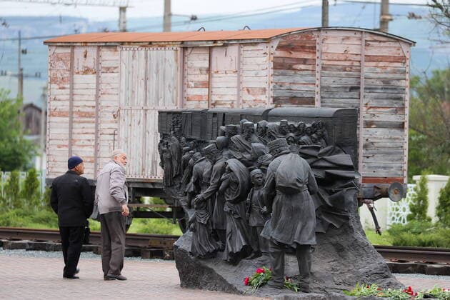 CRIMEA, RUSSIA â€“ MAY 16, 2022: People at the group of statues The Last Family at the Path of Revival of the Peoples of Crimea memorial at the Siren rail station in the Bakhchisarai District on the Day of Remembrance for the Deportation of the Peoples of Crimea. Crimea has been commemorating the Day of Remembrance for the Deportation of the Peoples of Crimea on 18 May since 1994. This tradition was established in memory of the forced deporation of the Crimean Tatars that began in 1944. Sergei Malgavko TASS  TS131A99