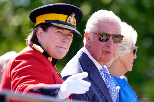 May 18, 2022, Ottawa, ON, Canada: Prince Charles and Camilla, Duchess of Cornwall, talk with RCMP Commissioner Brenda Lucki as they watch a performance of the RCMP Musical Ride, in Ottawa on their Canadian Royal Tour, Wednesday, May 18, 2022. Ottawa Canada - ZUMAc35_ 20220518_zaf_c35_100 Copyright: xPaulxChiassonx