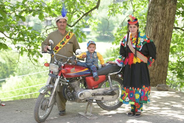 Pakistan: Chilmjushi Festival in the Kalsh Valley Kalashi women and men wearing traditional dresses participating in the dance during the Chilmjushi Festival in the Kalsh Valley. Chilum Joshi is also known as a Kalash spring festivals. Dressed up in newly knitted clothes with elaborate headgear and jewelry in vibrant colors , Kalasha women dance to traditional drumbeats during the chilum joshi festivals that concluded here at the scenic Bamburet valley on Sunday with fanfare. The four days event attracted an unprecedented number of tourists including a group of 22 Malaysian motorcyclists, besides the French, Australian and Italian nationals, on the concluding day of the festival young men women select their life partners while each day f Copyright: RanaxSajidxHussain