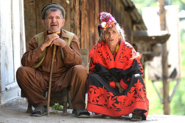 Pakistan: Chilmjushi Festival in the Kalsh Valley Kalashi women and men wearing traditional dresses participating in the dance during the Chilmjushi Festival in the Kalsh Valley. Chilum Joshi is also known as a Kalash spring festivals. Dressed up in newly knitted clothes with elaborate headgear and jewelry in vibrant colors , Kalasha women dance to traditional drumbeats during the chilum joshi festivals that concluded here at the scenic Bamburet valley on Sunday with fanfare. The four days event attracted an unprecedented number of tourists including a group of 22 Malaysian motorcyclists, besides the French, Australian and Italian nationals, on the concluding day of the festival young men women select their life partners while each day f Copyright: RanaxSajidxHussain