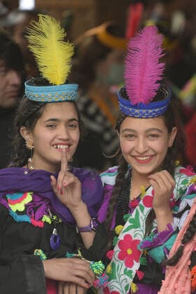 Pakistan: Chilmjushi Festival in the Kalsh Valley Kalashi women and men wearing traditional dresses participating in the dance during the Chilmjushi Festival in the Kalsh Valley. Chilum Joshi is also known as a Kalash spring festivals. Dressed up in newly knitted clothes with elaborate headgear and jewelry in vibrant colors , Kalasha women dance to traditional drumbeats during the chilum joshi festivals that concluded here at the scenic Bamburet valley on Sunday with fanfare. The four days event attracted an unprecedented number of tourists including a group of 22 Malaysian motorcyclists, besides the French, Australian and Italian nationals, on the concluding day of the festival young men women select their life partners while each day f Copyright: RanaxSajidxHussain