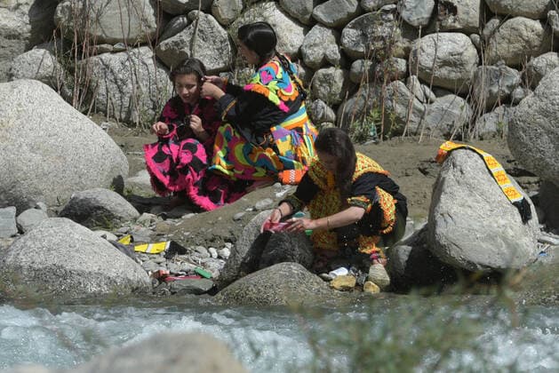 Pakistan: Chilmjushi Festival in the Kalsh Valley Kalashi women and men wearing traditional dresses participating in the dance during the Chilmjushi Festival in the Kalsh Valley. Chilum Joshi is also known as a Kalash spring festivals. Dressed up in newly knitted clothes with elaborate headgear and jewelry in vibrant colors , Kalasha women dance to traditional drumbeats during the chilum joshi festivals that concluded here at the scenic Bamburet valley on Sunday with fanfare. The four days event attracted an unprecedented number of tourists including a group of 22 Malaysian motorcyclists, besides the French, Australian and Italian nationals, on the concluding day of the festival young men women select their life partners while each day f Copyright: RanaxSajidxHussain