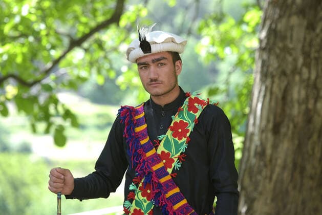 Pakistan: Chilmjushi Festival in the Kalsh Valley Kalashi women and men wearing traditional dresses participating in the dance during the Chilmjushi Festival in the Kalsh Valley. Chilum Joshi is also known as a Kalash spring festivals. Dressed up in newly knitted clothes with elaborate headgear and jewelry in vibrant colors , Kalasha women dance to traditional drumbeats during the chilum joshi festivals that concluded here at the scenic Bamburet valley on Sunday with fanfare. The four days event attracted an unprecedented number of tourists including a group of 22 Malaysian motorcyclists, besides the French, Australian and Italian nationals, on the concluding day of the festival young men women select their life partners while each day f Copyright: RanaxSajidxHussain