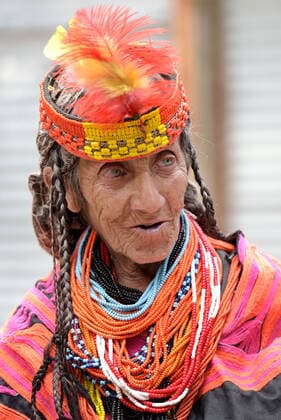 Pakistan: Chilmjushi Festival in the Kalsh Valley Kalashi women and men wearing traditional dresses participating in the dance during the Chilmjushi Festival in the Kalsh Valley. Chilum Joshi is also known as a Kalash spring festivals. Dressed up in newly knitted clothes with elaborate headgear and jewelry in vibrant colors , Kalasha women dance to traditional drumbeats during the chilum joshi festivals that concluded here at the scenic Bamburet valley on Sunday with fanfare. The four days event attracted an unprecedented number of tourists including a group of 22 Malaysian motorcyclists, besides the French, Australian and Italian nationals, on the concluding day of the festival young men women select their life partners while each day f Copyright: RanaxSajidxHussain