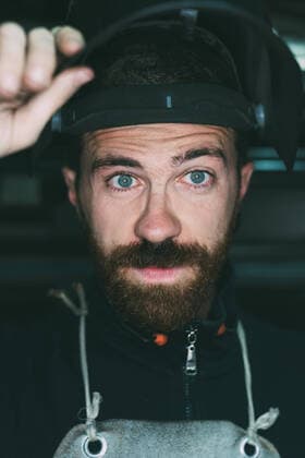 Creative Highlights Symbolbilder Portrait of male metalworker holding up welding mask, 06.02.2017, Copyright: xEugenioxMarongiux, model released, , property released, wearing,holding,metalworking,welding,looking at camera,working,front view,head and shoulders,portrait,small business,traditional,skill,mid adult,30 to 34 years,blue eye,hand,caucasian ethnicity,mid adult man,only one mid adult man,one person,welder,beard,indoors,workshop,apron,welding mask,artisan,small business owner,work,only male,forge,blacksmith,protective workwear,health-and-safety,metalwork,February 2017 Release,metalworker,Welding,Holding,Working,Caucasian Ethnicity,Mid Adult,30-34 Years,Male,Men,Mid Adult Men,Manual Worker,Blacksmith,Metal Worker,Welder,Skill,Traditional,One Person,Head And Shoulder IS09B4FA7