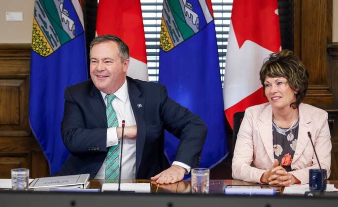 May 20, 2022, Calgary, AB, CANADA: Alberta Premier Jason Kenney, left, says he will stay in the top job to maintain continuity and stability in government until a new United Conservative party leader is chosen, in Calgary, Alta., Friday, May 20, 2022. Calgary CANADA - ZUMAc35_ 20220520_zaf_c35_061 Copyright: xJeffxMcintoshx