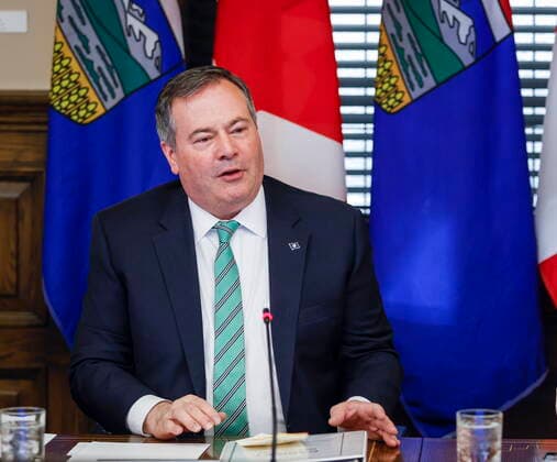 May 20, 2022, Calgary, AB, CANADA: Alberta Premier Jason Kenney, left, says he will stay in the top job to maintain continuity and stability in government until a new United Conservative party leader is chosen, in Calgary, Alta., Friday, May 20, 2022. Calgary CANADA - ZUMAc35_ 20220520_zaf_c35_065 Copyright: xJeffxMcintoshx