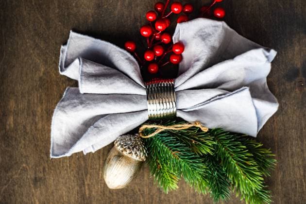 Festive table setting with napkin in ring decorated with red berries and christmas tree branches on wooden table , 34382160.jpg, 24 december, celebration, christmas, christmas cheer, december, decoration, dinner, festive, food, holiday, joy, merrychristmas, napkin, newyear, ornament, red berries, rustic, served, set, setting, table, textile, winter, wooden, xmas,