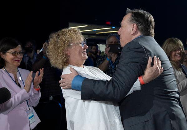 May 28, 2022, DRUMMONDVILLE, PQ, Canada: Quebec Premier Francois Legault, right, hugs Quebec Minister Responsible for Seniors and Informal Caregivers Marguerite Blais while Quebec Minister of Higher Education Danielle McCann, left, applauds at the beginning of a Coalition Avenir Quebec annual congress, in Drummondville, Que., Saturday, May 28, 2022. Neither Blais or McCann will run as candidate for the CAQ in the fall election. DRUMMONDVILLE Canada  - ZUMAc35_ 20220528_zaf_c35_007 Copyright: xJacquesxBoissinotx