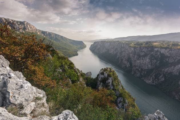 Cliffs over Danube river, Djerdap National park, east Serbia. View from the top of the cliffs of Djerdap gorge during sunset, Vintage and dark toned , 20106442.jpg, ancient, balkan, border, canyon, carpathian, cloud, colors, danube, depth, destination, dramatic, europe, flow, gate, gorge, green, high, hill, iron, landmark, landscape, mountain, national, natural, nature, outdoor, park, ravines, river, riverbank, rock, rocky, romania, scenery, scenic, serbia, sky, stone, summer, sunny, sunset, tourism, travel, trees, valley, water,