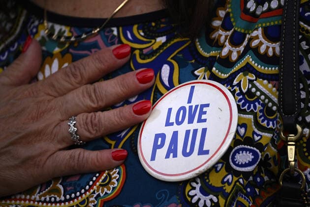 A fan wears an I love Paul button as she attends Paul McCartney s performance at the Camping World Stadium in Orlando, Florida on Saturday, May 28, 2022.  ORP20220528031 JOExMARINO