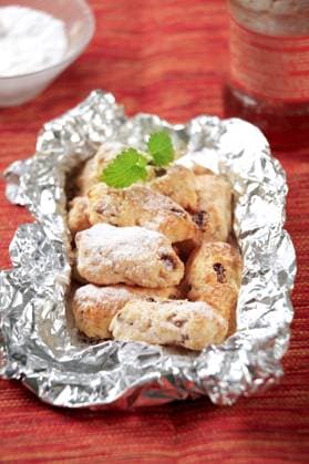 Mini Christmas stollen cakes in aluminum foil , 20368524.jpg, nobody, closeup, tinfoil, aluminum foil, gourmet, treat, indulgence, German cuisine, food, baked, icing sugar, confectionery, dessert, filled, sweet, almond, dried fruit, raisins, marzipan, Christmas, cakes, mini, stollen,