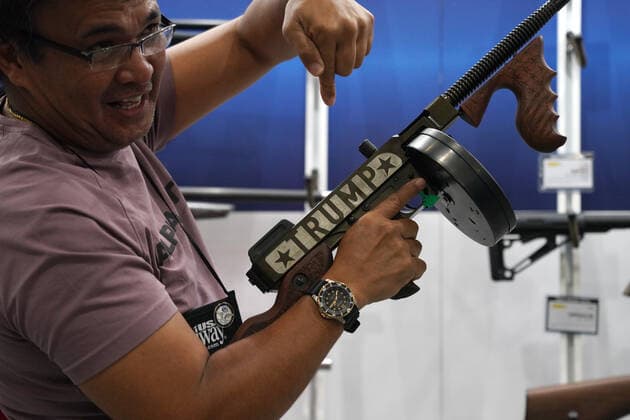 May 28, 2022, Boston, Massachusetts, US: A man holds a Trump gun at the annual NRA Meeting at the George R. Brown Convention Center in Houston, Texas on May 28, 2022. Just 3 days before a mass shooting occurred 4 hours away in Uvalde, Texas killing 19 children and 2 adults. Boston US - ZUMAd211 20220528_zap_d211_021 Copyright: xAllisonxDinnerx