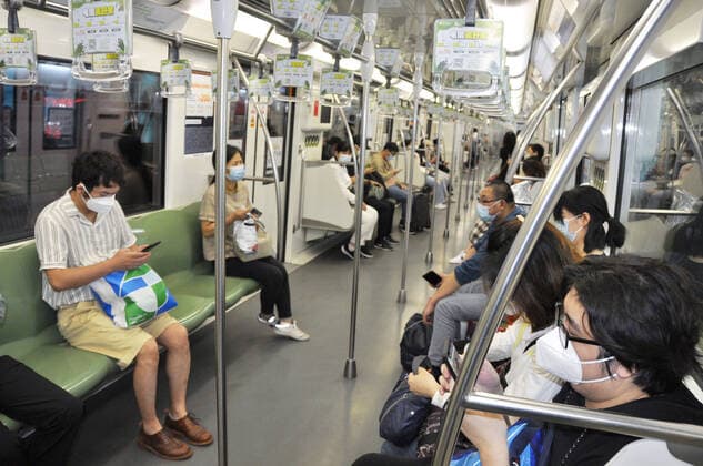 Shanghai lifts 2-month-long lockdown People wearing face masks ride a subway train in Shanghai on June 1, 2022, as the Chinese city lifts its two-month-long lockdown, allowing around 90 percent of its residents to leave home.  A14AA0001295673P