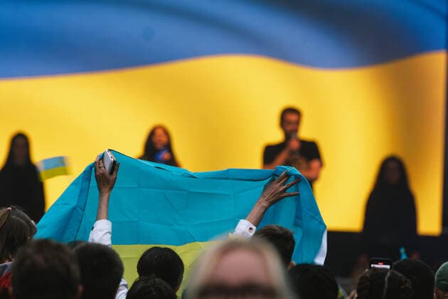 Benefit Concert For Supporting Ukrainian In Essen a woman holds a Ukrain flag as Ukrainian singer Ruslana sings during the Benefit concert held in support of the Ukrain people who affected by the war in Kennedy square in Essen, Germany on June 7, 2022 Essen Germany  Copyright: xYingxTangx originalFilename: tang-notitle220607_np3UN.jpg