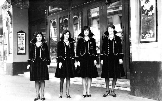 Usherettes standing in the doorway of the New Strand Theatre, Liverpool Street, Hobart (1930) - Mandatory Photo : TAHO 1062_05_M_-11648-