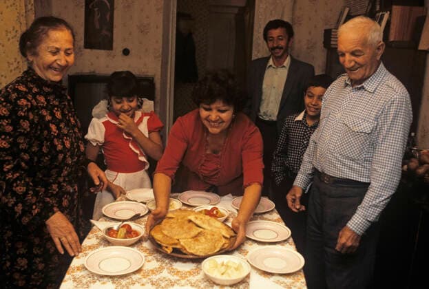 Crimean Tatars 8205086 09.09.1990 Crimean Region, Ukrainian SSR. On November 14, 1989, the USSR Supreme Soviet adopted a declaration restoring the deported ethnicities rights. Crimean Tatars started to return from deportation. The Suleimanov family expecting guests. Vladimir Fedorenko Republic of Crimea Russia  Copyright: xVladimirxFedorenkox