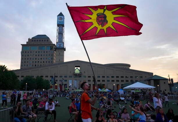 June 21, 2022, MISSISSAUGA, ON, CANADA: A man waves a Six Nations flag as people listen to live music during National Indigenous Peoples Day in Mississauga, Ont., on Tuesday, June 21, 2022. MISSISSAUGA CANADA  - ZUMAc35_ 20220621_zaf_c35_126 Copyright: xNathanxDenettex