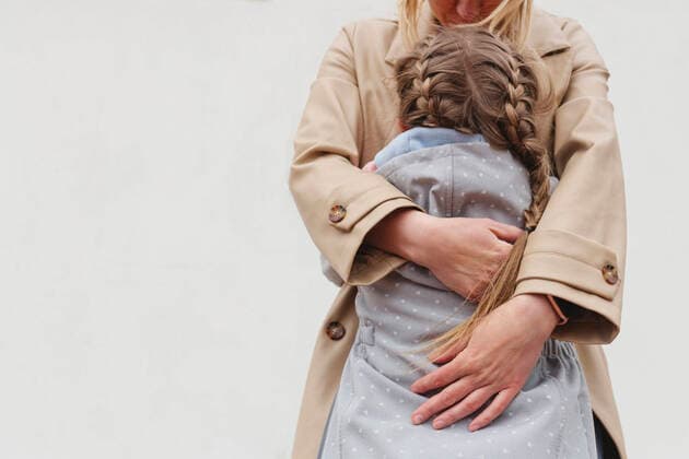 Creative Highlights Symbolbilder Girl with braided hair embracing mother against white background model released, Symbolfoto, IHF00875