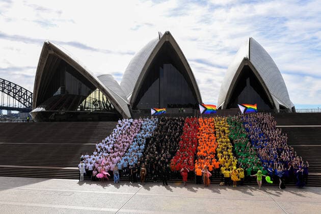 News Themen der Woche KW25 SYDNEY WORLDPRIDE 2023, Close to 1,000 participates dress in colours to create the LGBTQIA+ Progress Flag on the steps of the Sydney Opera House during the anniversary of the first Sydney Gay and Lesbian Mardi Gras in 1978, Sydney, Friday, June 24, 2022. ( NO ARCHIVING, EDITORIAL USE ONLY, NO USE IN BOOKS WITHOUT CONSENT SYDNEY NSW AUSTRALIA  Copyright: xBIANCAxDExMARCHIx 20220624001672767827
