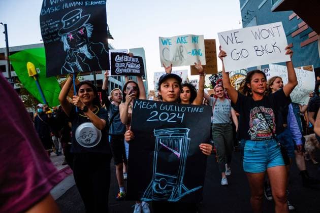 June 24, 2022, Reno, Nevada, United States: Protesters march with placards expressing their opinion after sunset during Scotus protest. Protestors gather after SCOTUS over turned Roe v. Wade. Reno United States - ZUMAs197 20220624_zaa_s197_379 Copyright: xTyxONeilx