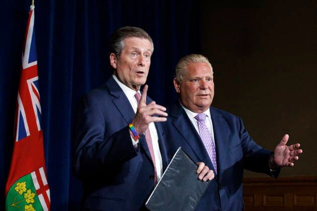 June 27, 2022, TORONTO, ON, Canada: Toronto mayor John Tory, left, speaks alongside Ontario premier Doug Ford during a joint press conference inside QueenöÄÃ s Park in Toronto, Monday, June 27, 2022. TORONTO Canada  - ZUMAc35_ 20220627_zaf_c35_044 Copyright: xColexBurstonx