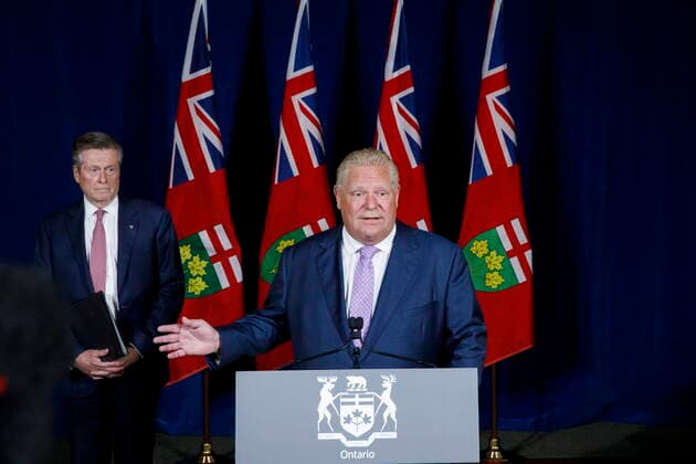 June 27, 2022, TORONTO, ON, Canada: Toronto Mayor John Tory, listens to Ontario Premier Doug Ford during a joint press conference inside QueenöÄÃ s Park in Toronto, Monday, June 27, 2022. TORONTO Canada  - ZUMAc35_ 20220627_zaf_c35_051 Copyright: xColexBurstonx