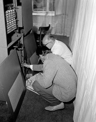 Trip to Europe: Arrival in Vienna, Austria 10:50AM; White House Army Signal Agency (WHASA) staff in Vienna. Two unidentified men work on White House Army Signal Agency (WHASA) equipment in preparation for a summit between President John F. Kennedy and Soviet Union Premier Nikita Khrushchev in Vienna, Austria. Copyright: xpiemagsx