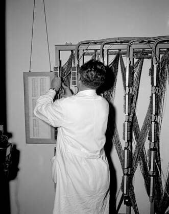 Trip to Europe: Arrival in Vienna, Austria 10:50AM; White House Army Signal Agency (WHASA) staff in Vienna. An unidentified man works on White House Army Signal Agency (WHASA) equipment in preparation for a summit between President John F. Kennedy and Soviet Union Premier Nikita Khrushchev in Vienna, Austria. Copyright: xpiemagsx