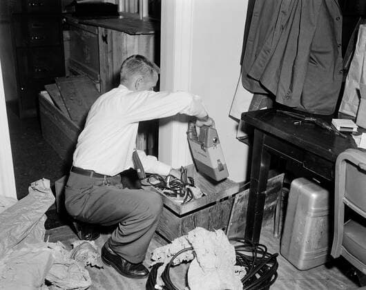 Trip to Europe: Arrival in Vienna, Austria 10:50AM; White House Army Signal Agency (WHASA) staff in Vienna. An unidentified man unpacks White House Army Signal Agency (WHASA) equipment in preparation for a summit between President John F. Kennedy and Soviet Union Premier Nikita Khrushchev in Vienna, Austria. Copyright: xpiemagsx