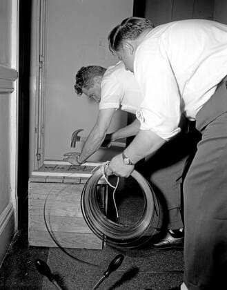 Trip to Europe: Arrival in Vienna, Austria 10:50AM; White House Army Signal Agency (WHASA) staff in Vienna. Two unidentified White House Army Signal Agency (WHASA) staff members prepare equipment for a summit between President John F. Kennedy and Soviet Union Premier Nikita Khrushchev in Vienna, Austria. Copyright: xpiemagsx
