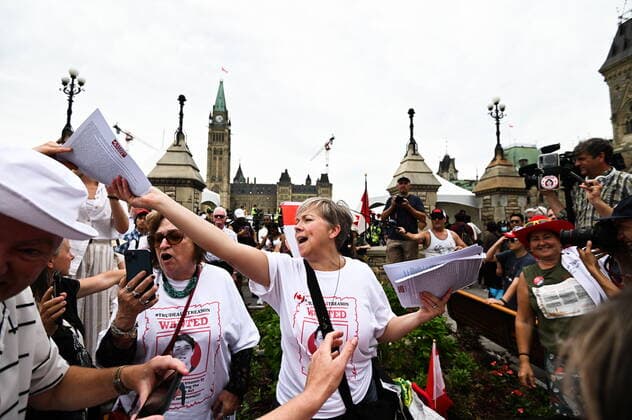 July 1, 2022, Ottawa, ON, Canada: People protesting against COVID-19 health measures hand out copies of the Constitution during a demonstration in the downtown core of Ottawa, Ont. during Canada Day celebrations on Friday, July 1, 2022. Ottawa Canada  - ZUMAc35_ 20220701_zaf_c35_059 Copyright: xSpencerxColbyx